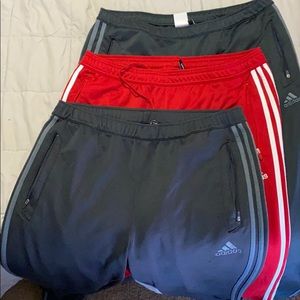 Lot of threw gently used Adidas athletic pants.